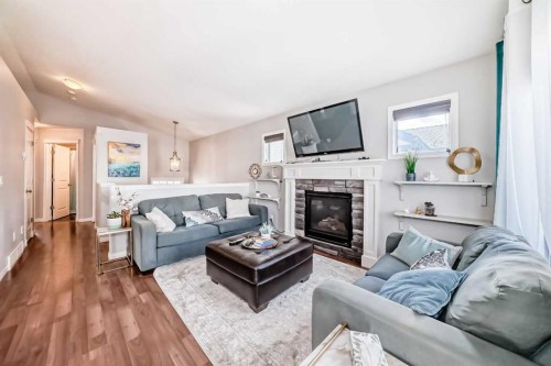 21 Valley Crescent, Blackfalds, AB - Indoor Photo Showing Living Room With Fireplace