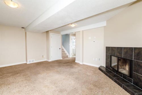 55 Patterson Crescent, Red Deer, AB - Indoor Photo Showing Other Room With Fireplace