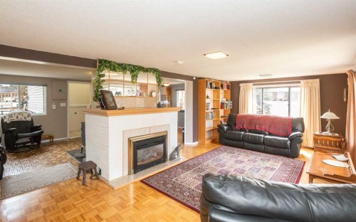 2731 6 Street, Calling Lake, AB - Indoor Photo Showing Living Room With Fireplace
