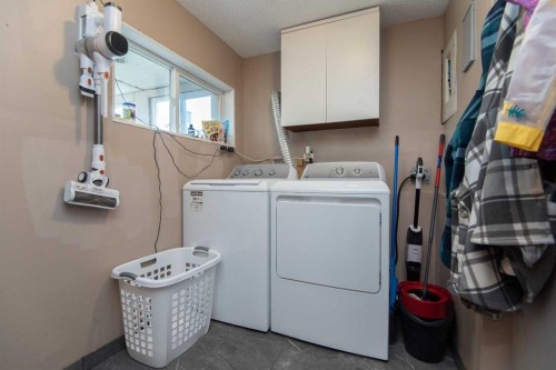 5024 49 Street, Clive, AB - Indoor Photo Showing Laundry Room