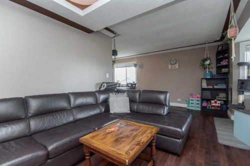 5024 49 Street, Clive, AB - Indoor Photo Showing Living Room