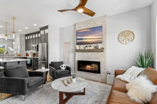 113-5210 Lakeshore Drive, Sylvan Lake, AB - Indoor Photo Showing Living Room With Fireplace