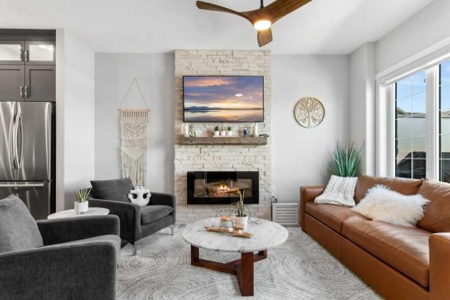 113-5210 Lakeshore Drive, Sylvan Lake, AB - Indoor Photo Showing Living Room With Fireplace