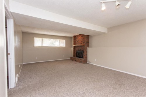 35 Oyen Crescent, Red Deer, AB - Indoor Photo Showing Other Room With Fireplace