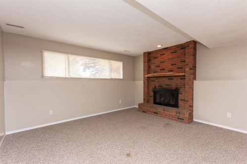 35 Oyen Crescent, Red Deer, AB - Indoor Photo Showing Living Room With Fireplace