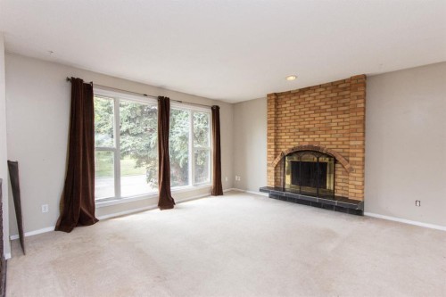 35 Oyen Crescent, Red Deer, AB - Indoor Photo Showing Living Room With Fireplace