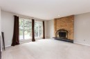 35 Oyen Crescent, Red Deer, AB  - Indoor Photo Showing Living Room With Fireplace 