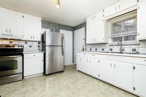 3905 46 Street, Red Deer, AB - Indoor Photo Showing Kitchen With Double Sink