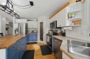 65 Asmundsen Avenue, Red Deer, AB  - Indoor Photo Showing Kitchen With Double Sink 
