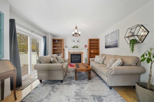 65 Asmundsen Avenue, Red Deer, AB - Indoor Photo Showing Living Room With Fireplace