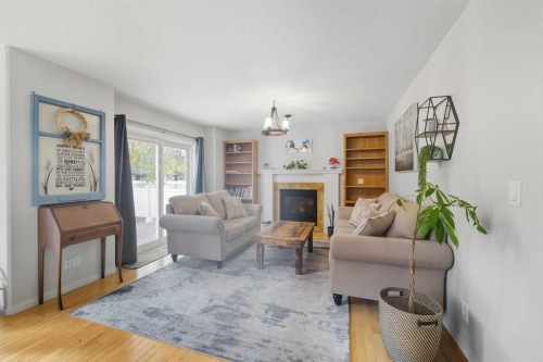 65 Asmundsen Avenue, Red Deer, AB - Indoor Photo Showing Living Room With Fireplace