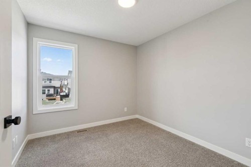 400 Fireside Drive, Cochrane, AB - Indoor Photo Showing Other Room