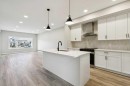 400 Fireside Drive, Cochrane, AB  - Indoor Photo Showing Kitchen With Upgraded Kitchen 