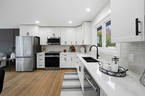 105 Cunningham Crescent, Red Deer, AB - Indoor Photo Showing Kitchen With Double Sink