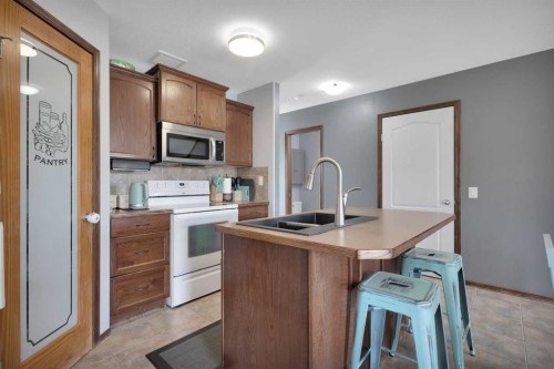 156 Oswald Close, Red Deer, AB - Indoor Photo Showing Kitchen With Double Sink