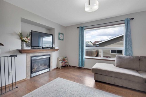 156 Oswald Close, Red Deer, AB - Indoor Photo Showing Living Room With Fireplace