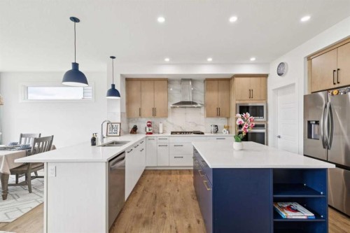 814 Bluerock Way Sw, Calgary, AB - Indoor Photo Showing Kitchen With Double Sink With Upgraded Kitchen