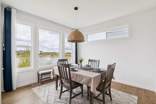 814 Bluerock Way Sw, Calgary, AB - Indoor Photo Showing Dining Room