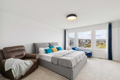 814 Bluerock Way Sw, Calgary, AB - Indoor Photo Showing Bedroom