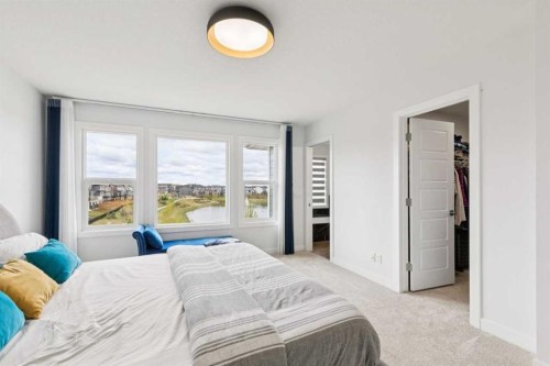 814 Bluerock Way Sw, Calgary, AB - Indoor Photo Showing Bedroom