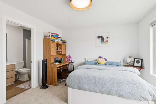 814 Bluerock Way Sw, Calgary, AB - Indoor Photo Showing Bedroom