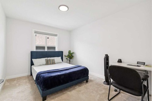 814 Bluerock Way Sw, Calgary, AB - Indoor Photo Showing Bedroom