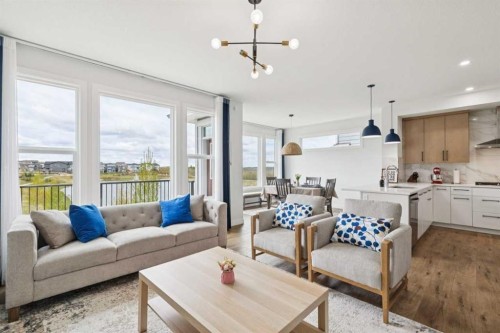 814 Bluerock Way Sw, Calgary, AB - Indoor Photo Showing Living Room