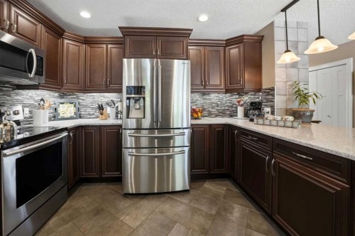 112 Denison Crescent, Red Deer, AB - Indoor Photo Showing Kitchen With Upgraded Kitchen