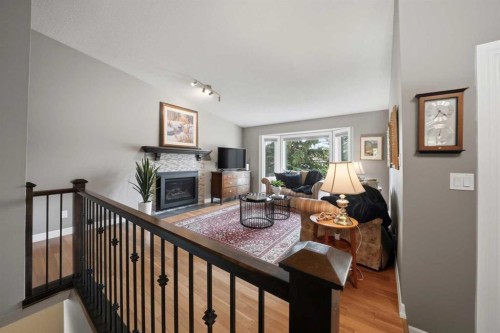112 Denison Crescent, Red Deer, AB - Indoor Photo Showing Living Room With Fireplace