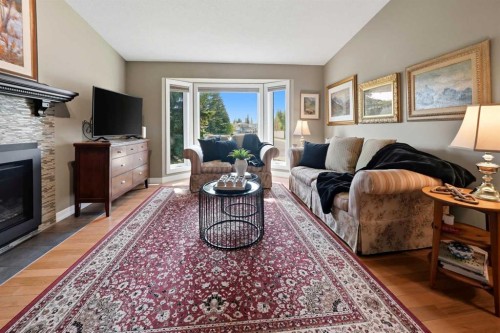 112 Denison Crescent, Red Deer, AB - Indoor Photo Showing Living Room With Fireplace