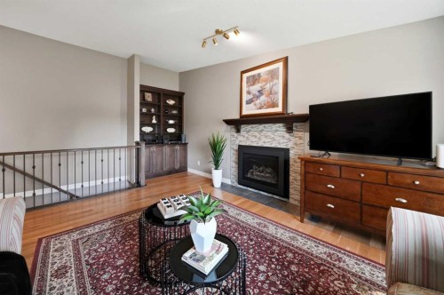 112 Denison Crescent, Red Deer, AB - Indoor Photo Showing Living Room With Fireplace