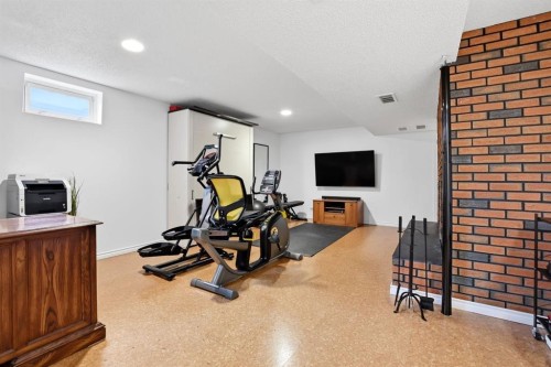 60 Anquetel Close, Red Deer, AB - Indoor Photo Showing Gym Room