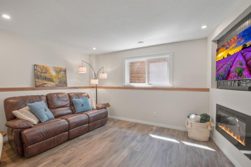 14 Tagish Avenue, Red Deer, AB - Indoor Photo Showing Living Room With Fireplace
