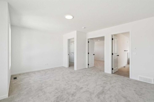 156 Southborough Common, Cochrane, AB - Indoor Photo Showing Other Room