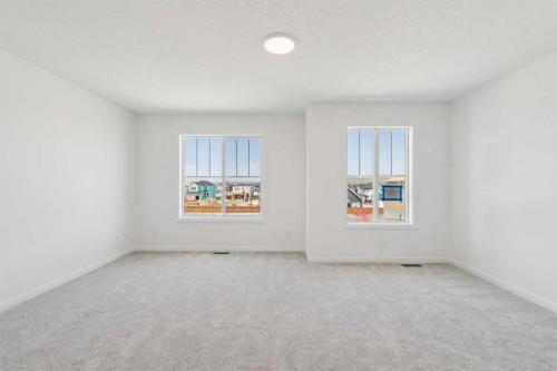 156 Southborough Common, Cochrane, AB - Indoor Photo Showing Other Room