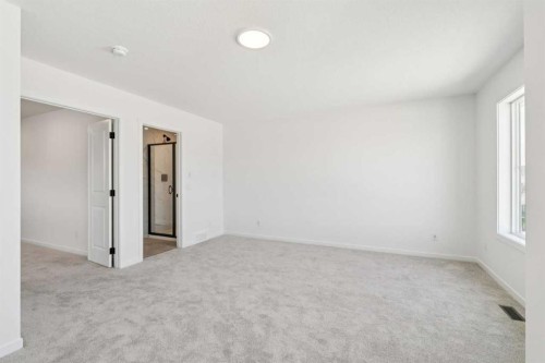 156 Southborough Common, Cochrane, AB - Indoor Photo Showing Other Room