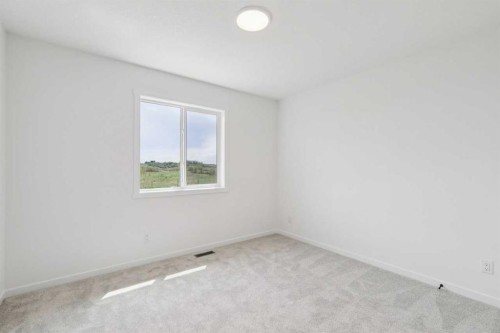 156 Southborough Common, Cochrane, AB - Indoor Photo Showing Other Room