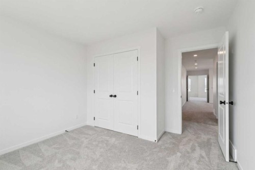 156 Southborough Common, Cochrane, AB - Indoor Photo Showing Other Room
