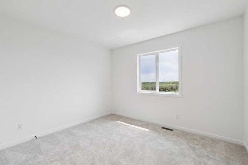 156 Southborough Common, Cochrane, AB - Indoor Photo Showing Other Room