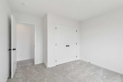156 Southborough Common, Cochrane, AB - Indoor Photo Showing Other Room