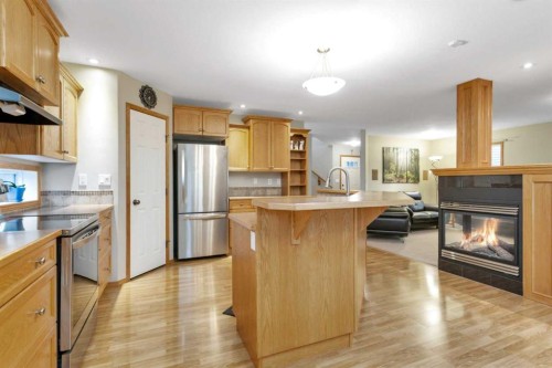 35 Lang Close, Red Deer, AB - Indoor Photo Showing Kitchen With Fireplace