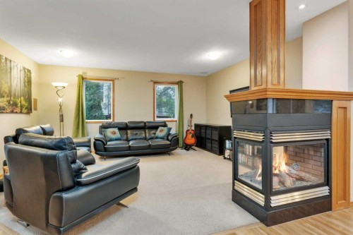 35 Lang Close, Red Deer, AB - Indoor Photo Showing Living Room With Fireplace