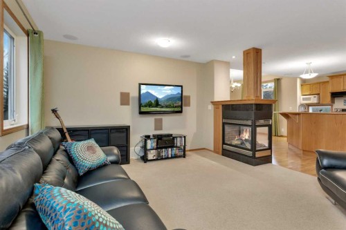 35 Lang Close, Red Deer, AB - Indoor Photo Showing Living Room With Fireplace