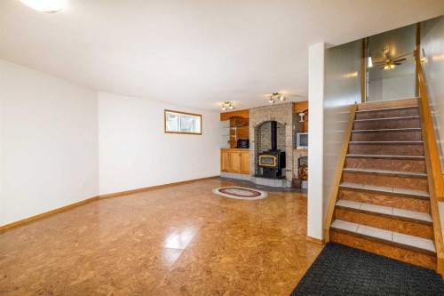 39508B Rr271, Rural Lacombe County, AB - Indoor Photo Showing Other Room With Fireplace