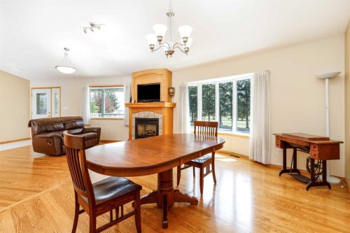 39508B Rr271, Rural Lacombe County, AB - Indoor Photo Showing Dining Room With Fireplace