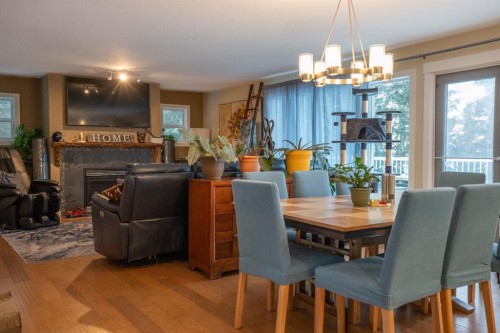 642 Cedar Way, Rural Camrose County, AB - Indoor Photo Showing Dining Room With Fireplace