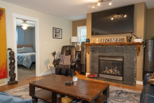 642 Cedar Way, Rural Camrose County, AB - Indoor Photo Showing Living Room With Fireplace