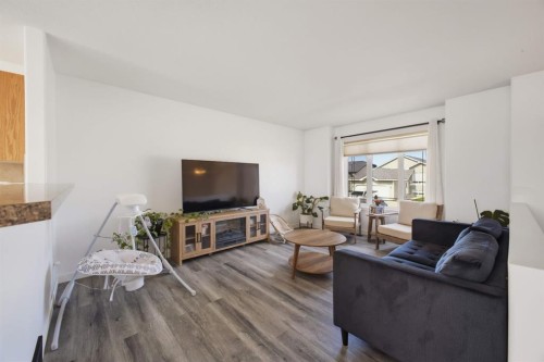 62 Mcdougall Close, Penhold, AB - Indoor Photo Showing Living Room