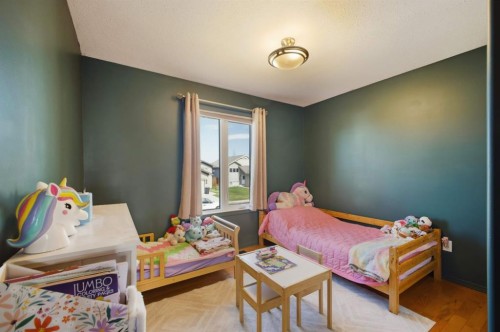 62 Mcdougall Close, Penhold, AB - Indoor Photo Showing Bedroom