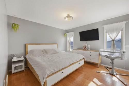 62 Mcdougall Close, Penhold, AB - Indoor Photo Showing Bedroom